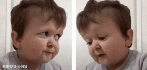 A Baby Is Making A Funny Face And Making A Funny Face . GIF