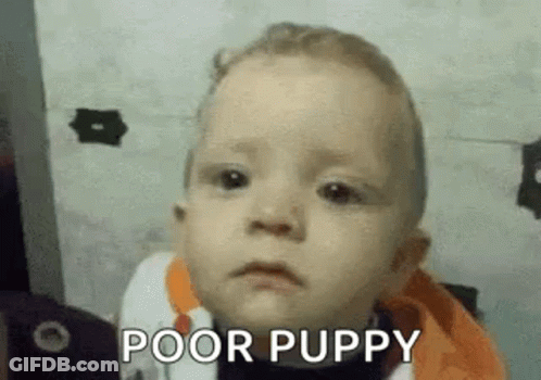 A Baby Is Making A Funny Face And Says `` Poor Puppy '' . GIF
