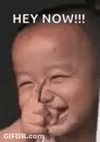 A Baby Is Making A Funny Face And Smiling With The Words `` Hey Now '' . GIF