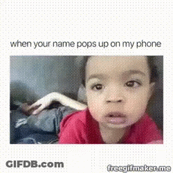 A Baby Is Making A Funny Face While Looking At The Camera . GIF