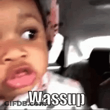 A Baby Is Making A Funny Face While Sitting In A Car . GIF