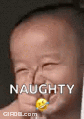 A Baby Is Making A Funny Face With A Smiley Face In His Mouth . GIF