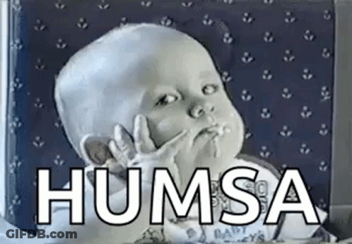 A Baby Is Making A Funny Face With His Hands In His Mouth And The Words Humsa Written Above Him . GIF