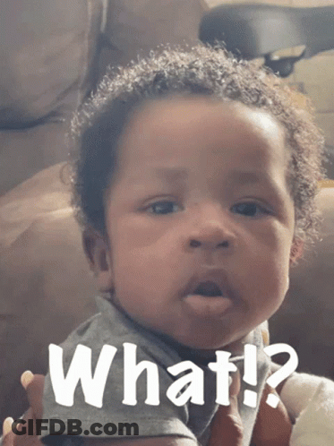 A Baby Is Making A Funny Face With The Words What Written Above Him GIF