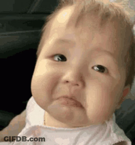 A Baby Is Making A Sad Face And Making A Funny Face . GIF