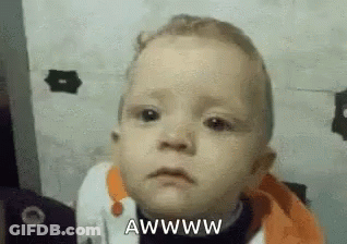 A Baby Is Making A Sad Face And Saying ` ` Awww ` ` . GIF