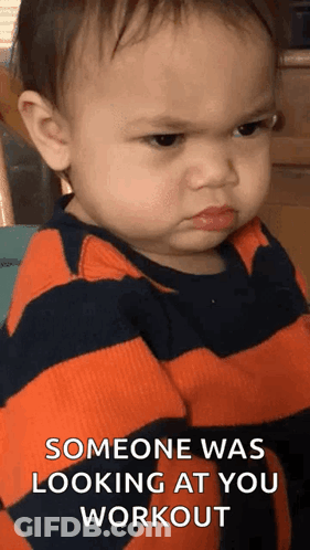 A Baby Is Making An Angry Face And Says `` Someone Was Looking At You Workout '' GIF