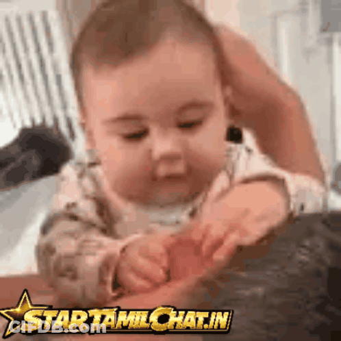 A Baby Is Playing With A Star Tamilchat.in Logo On The Bottom GIF