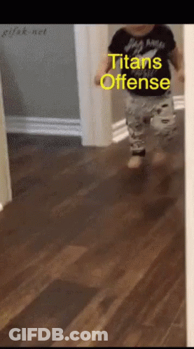 A Baby Is Running Down A Hallway With The Words Titans Offense Written On The Bottom GIF