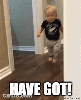 A Baby Is Running In A Hallway With The Words `` Have Got '' Written On The Floor . GIF