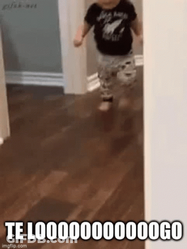 A Baby Is Running On A Wooden Floor In A Hallway With A Caption That Says Te Looo . GIF