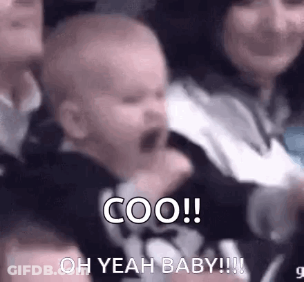 A Baby Is Screaming In A Crowd While Sitting In A Stadium . GIF