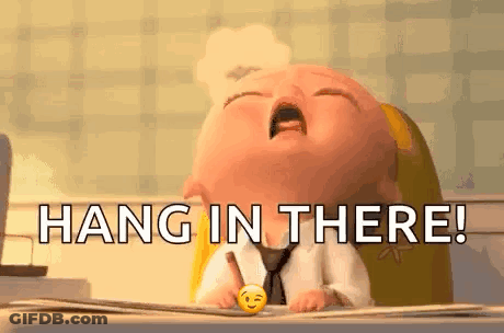 A Baby Is Sitting At A Desk With A Pen In His Hand And The Words `` Hang In There '' . GIF