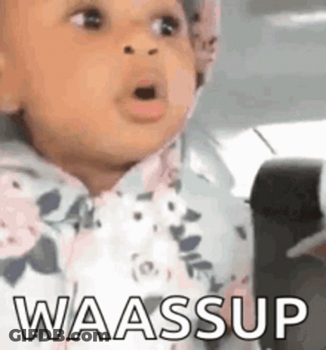 A Baby Is Sitting In A Car Seat And Making A Funny Face With The Words Waassup Written On It . GIF