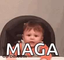 A Baby Is Sitting In A High Chair And Making A Funny Face . GIF