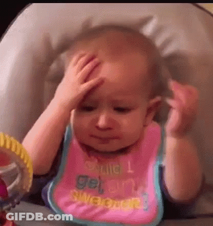 A Baby Is Sitting In A High Chair Holding Her Head . GIF