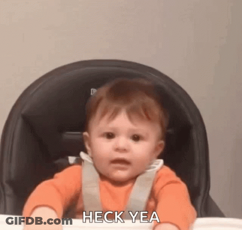 A Baby Is Sitting In A High Chair Making A Funny Face And Saying Heck Yea . GIF
