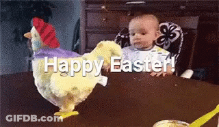 A Baby Is Sitting In A High Chair Next To A Stuffed Chicken That Says Happy Easter GIF