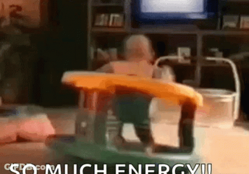 A Baby Is Sitting In A Walker In A Living Room With The Words `` So Much Energy ! '' GIF
