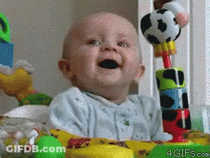 A Baby Is Sitting In Front Of A Table With Toys And The Website 4Gifs.com Is Visible GIF