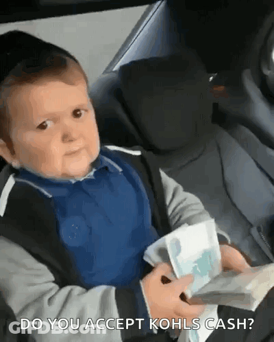 A Baby Is Sitting In The Back Seat Of A Car Holding A Bunch Of Money And Asking Do You Accept Kohls Cash . GIF