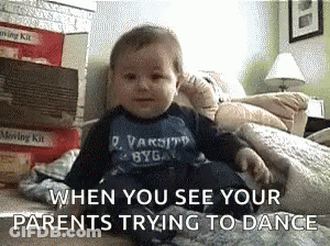 A Baby Is Sitting On A Bed With The Words " When You See Your Parents Trying To Dance " Above Him GIF