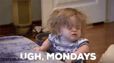 A Baby Is Sitting On A Couch With His Eyes Closed And Making A Funny Face . GIF
