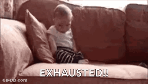 A Baby Is Sitting On A Couch With The Words `` Exhausted '' Written Above Him . GIF