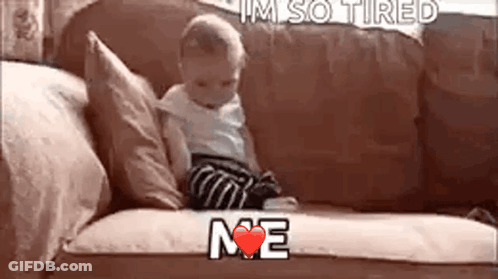 A Baby Is Sitting On A Couch With The Words `` I 'M So Tired Me '' Written On It . GIF