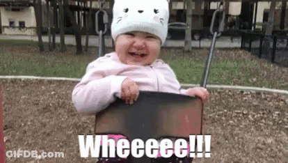 A Baby Is Sitting On A Swing At A Playground And Crying . GIF