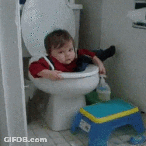 A Baby Is Sitting On A Toilet With A Blue Stool Next To It GIF