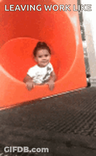 A Baby Is Sliding Down An Orange Slide With The Words Leaving Work Like Written On The Bottom GIF