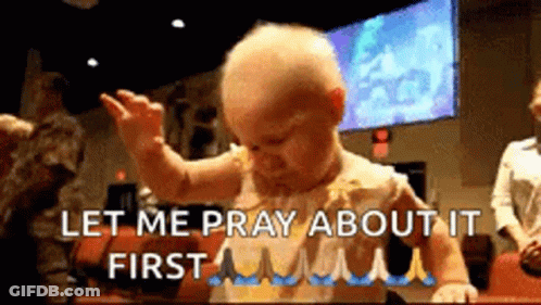 A Baby Is Standing In Front Of A Group Of People And Says Let Me Pray About It First . GIF