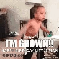 A Baby Is Walking In A Room With The Words `` I 'M Grown ! Happy Birthday Little Man '' Written On It . GIF