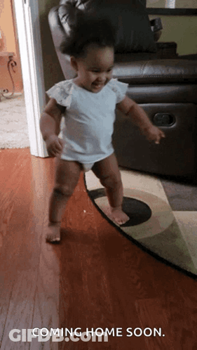 A Baby Is Walking On A Rug With The Words Coming Home Soon GIF