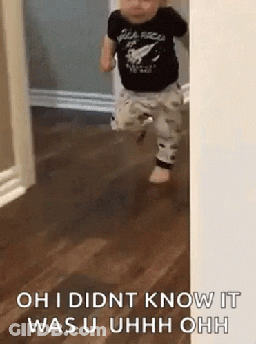 A Baby Is Walking Through A Doorway And Says `` Oh I Didnt Know It Was U Uhh Ohh '' . GIF