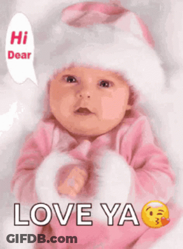 A Baby Is Wearing A Pink Outfit And A White Hat And Says Love Ya . GIF