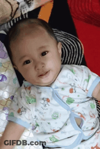 A Baby Is Wearing A Shirt That Says Tigger GIF