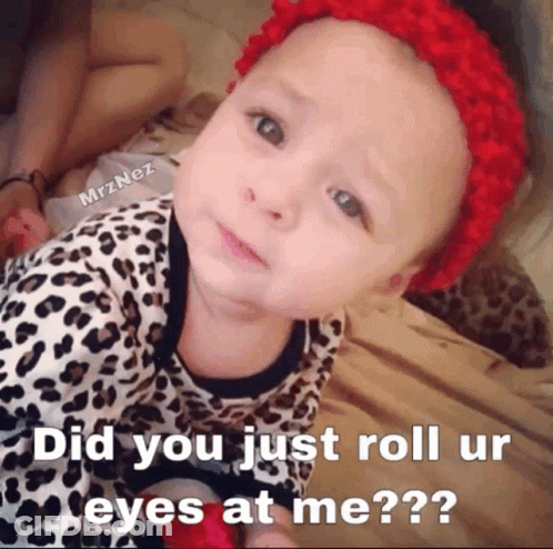 A Baby Laying On A Bed With A Caption That Says Did You Just Roll Ur Eyes At Me?? GIF