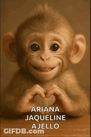 A Baby Monkey Is Making A Heart Shape With Its Hands GIF
