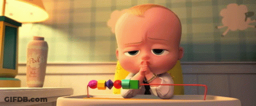 A Baby Sitting In A High Chair With A Bottle Of Baby Powder Behind Him GIF