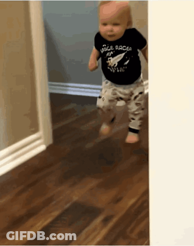 A Baby Wearing A Black Space Racer Shirt GIF