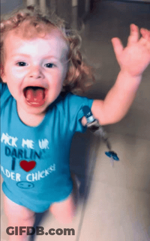 A Baby Wearing A Blue Shirt That Says " Pick Me Up Darlin " On It GIF