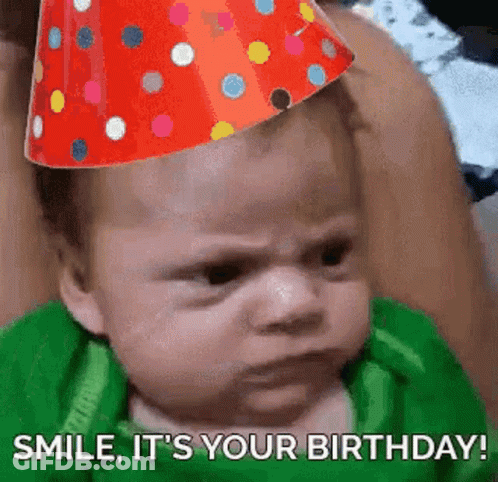 A Baby Wearing A Party Hat Is Making A Funny Face And Says `` Smile , It 'S Your Birthday ! '' GIF