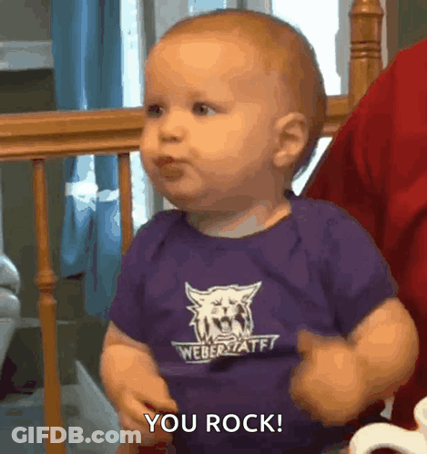 A Baby Wearing A Purple Weber State Shirt Says You Rock GIF