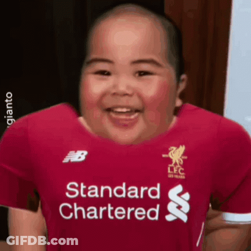 A Baby Wearing A Red Shirt That Says Standard Chartered On It GIF