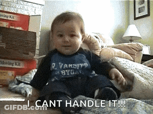 A Baby Wearing A Varsity Shirt Is Sitting On A Bed And Says I Cant Handle It GIF