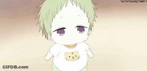 A Baby Wearing A White Shirt With A Cat On It . GIF