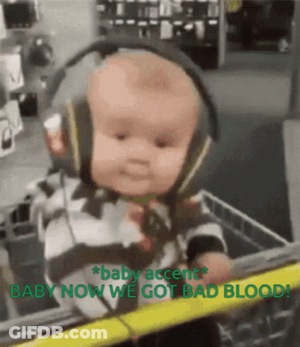 A Baby Wearing Headphones Is In A Shopping Cart With The Words Baby Accent Baby Now We Got Bad Blood GIF