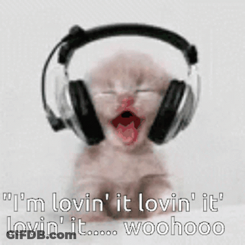 A Baby Wearing Headphones Says I 'M Lovin ' It Lovin ' It Lovin ' It GIF